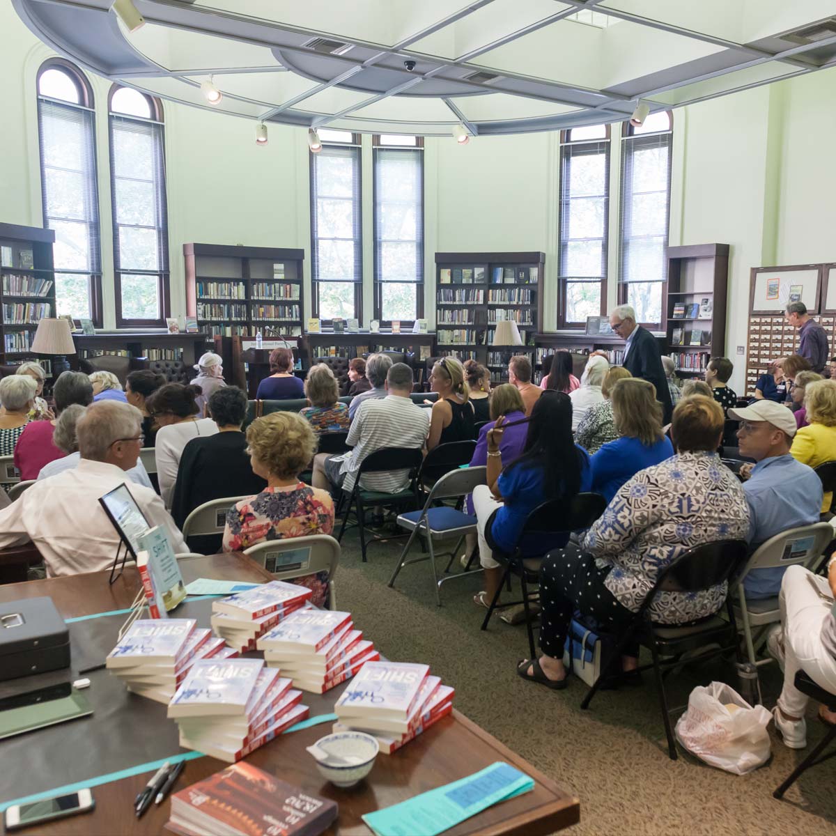 People listening to a lecture in the Carnegie Library International Poetry room