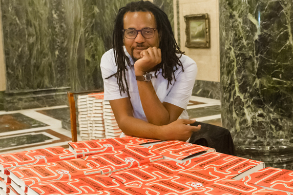 Colson Whitehead with copies of The Underground Railroad