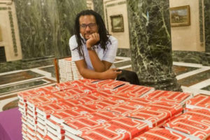 Colson Whitehead with his books