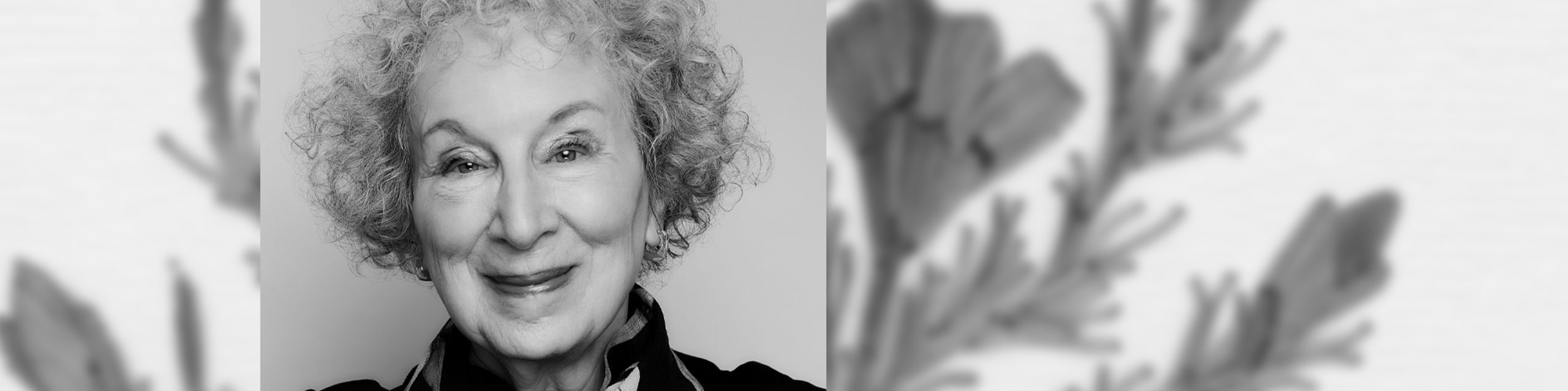 Black and White photo of Margaret Atwood smiling into camera
